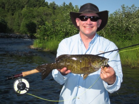 Mark Smallie French River Summer 2011.jpg - Mark with a Smallie from the French River caught on a fly.